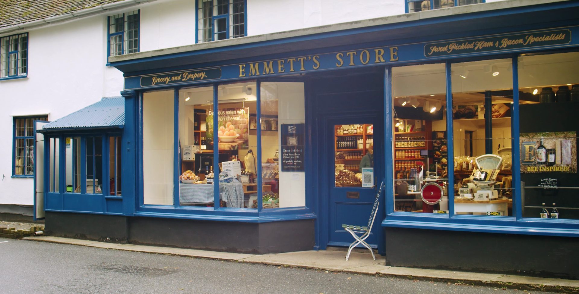 The blue shopfront of Emmett's Store in Peasenhall, Suffolk